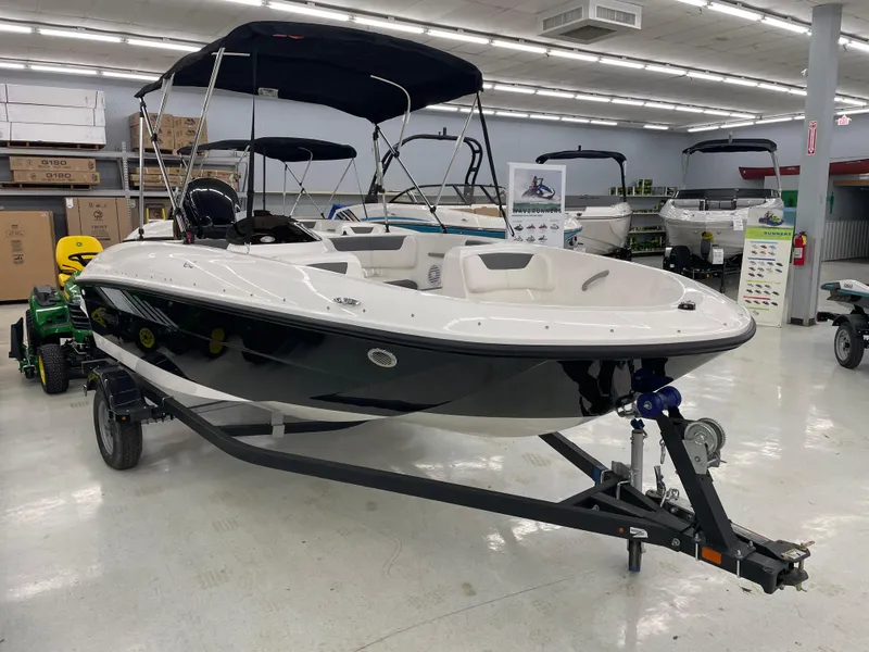 Slide: The Image of 2025 Bayliner Element E16 boat displayed in a showroom, featuring sleek design and modern amenities. - 5