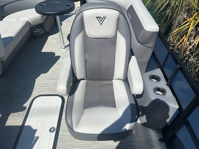 Slide: The Image of 2024 Viaggio V 20 U boat seat with cup holders and table on deck. - 9
