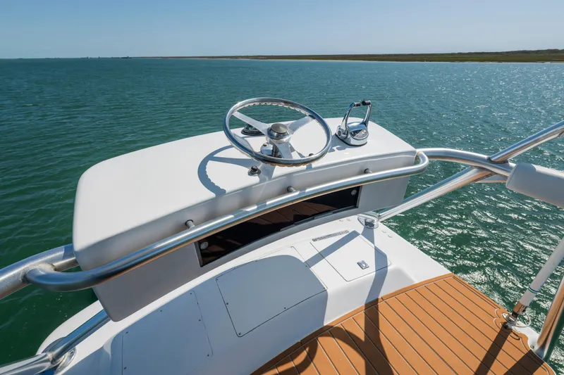 Slide: The Image of 2001 Viking Convertible yacht helm with ocean view and wooden deck. - 10