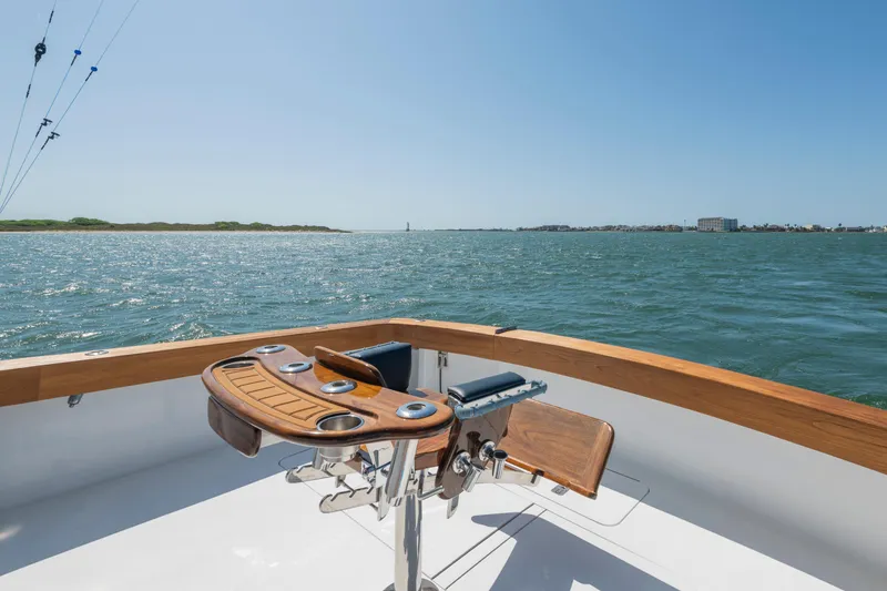 Slide: The Image of 2001 Viking Convertible boat deck overlooking calm ocean waters. - 15