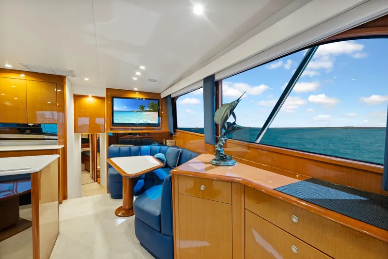Slide: The Image of Luxurious interior of a 2001 Viking Convertible yacht with ocean view and elegant furnishings. - 19