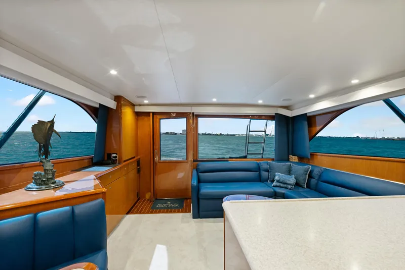 Slide: The Image of Luxurious interior of a 2001 Viking Convertible yacht with ocean view and elegant seating. - 20