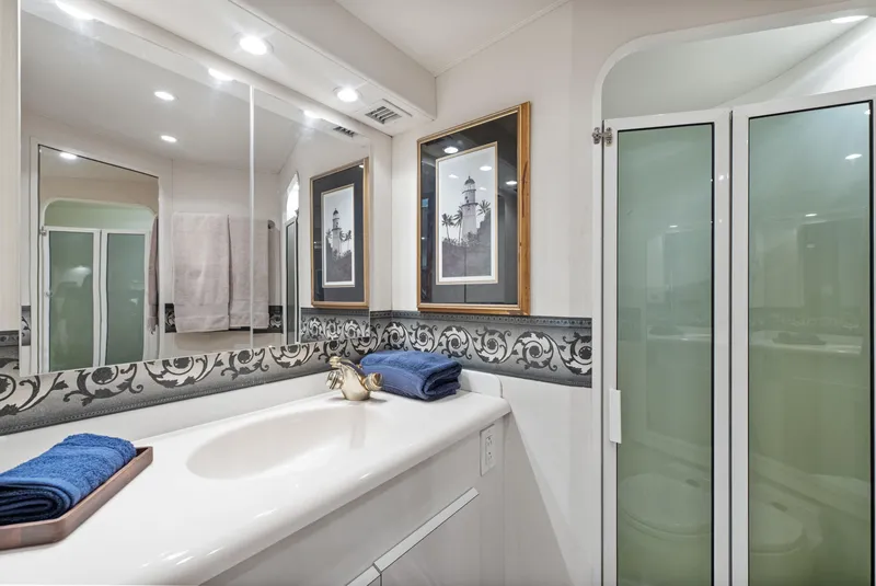 Slide: The Image of Luxurious bathroom in 2001 Viking Convertible yacht with elegant decor and modern fixtures. - 28