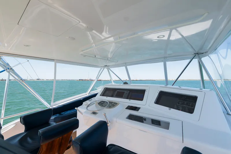 Slide: The Image of 2001 Viking Convertible yacht helm with ocean view and modern navigation equipment. - 6