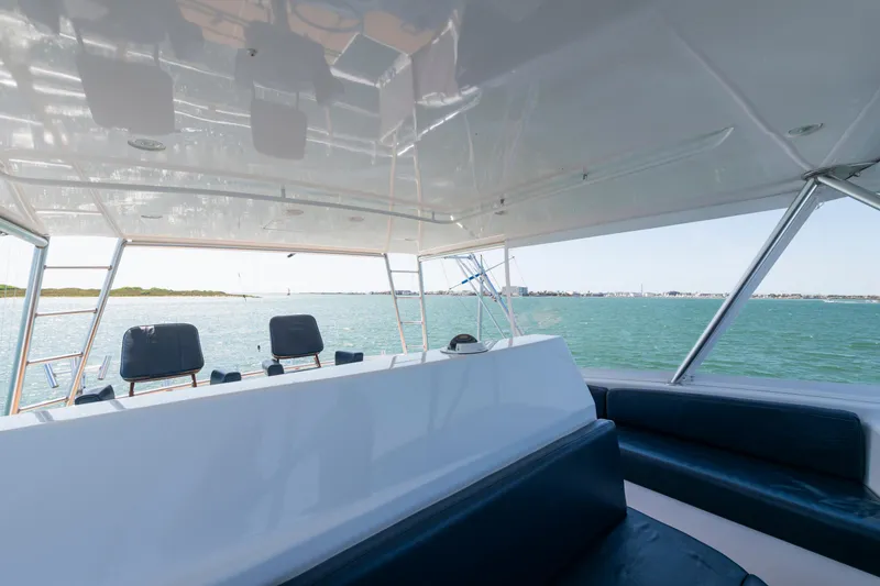 Slide: The Image of 2001 Viking Convertible yacht interior with ocean view and seating area. - 9