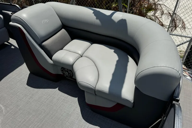 Slide: The Image of 2022 Manitou Oasis SR VP boat seating with gray upholstery and modern design. - 15