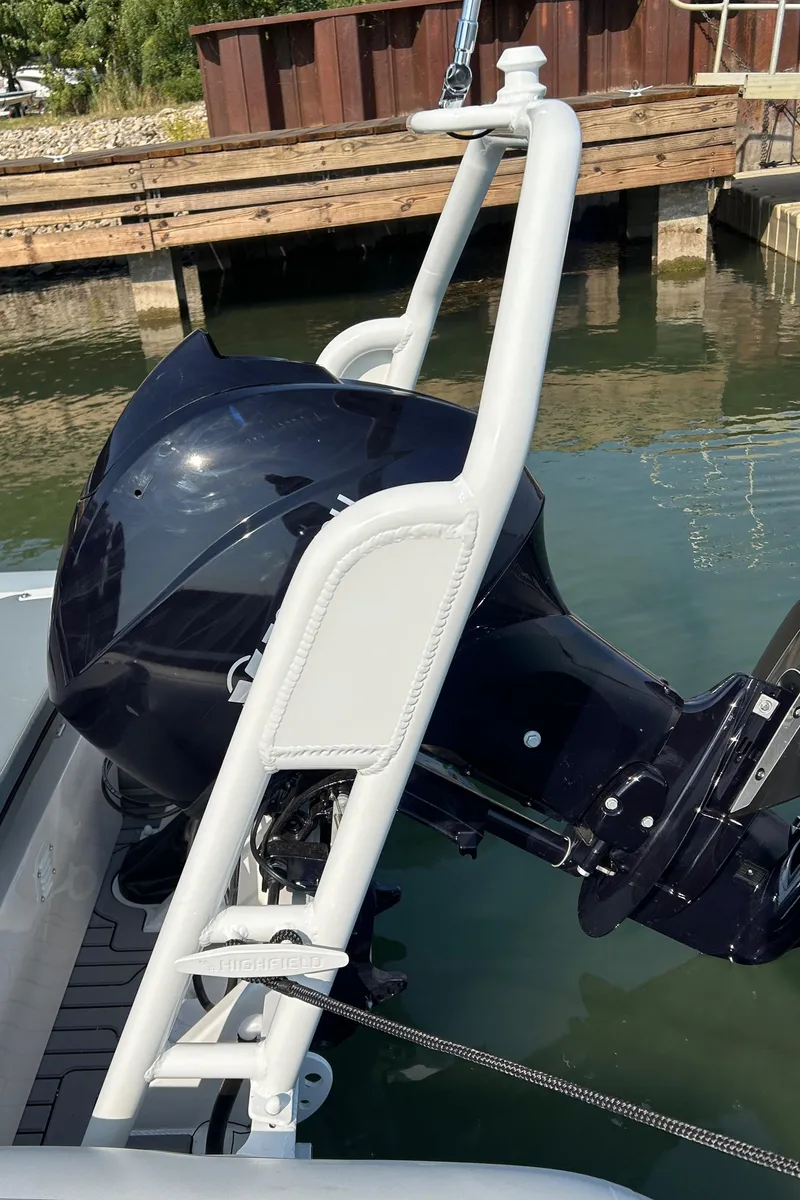 Slide: The Image of 2024 Highfield Classic 420 boat engine and ladder at dockside. - 14