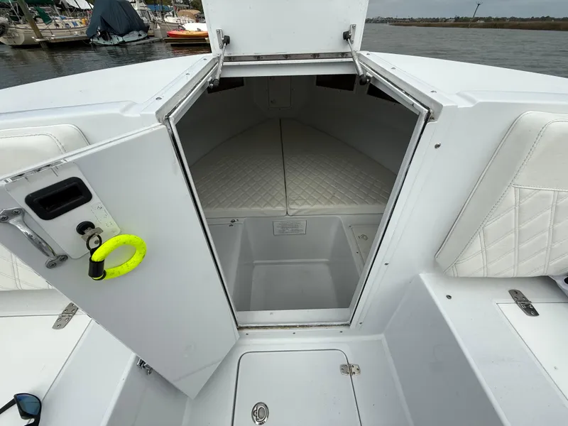 Slide: The Image of 2003 Strike 35 Cuddy boat interior with open cabin door, docked at marina. - 17
