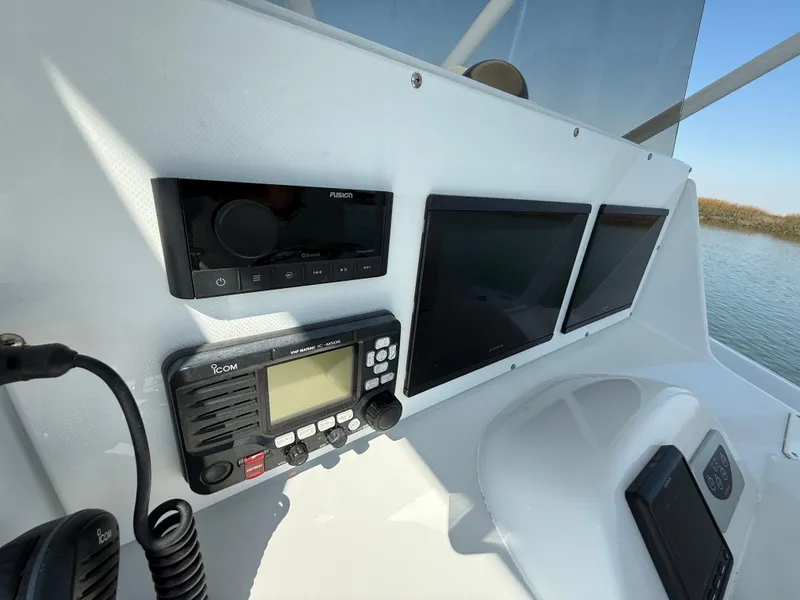 Slide: The Image of Control panel of 2003 Strike 35 Cuddy boat with navigation and communication equipment. - 22