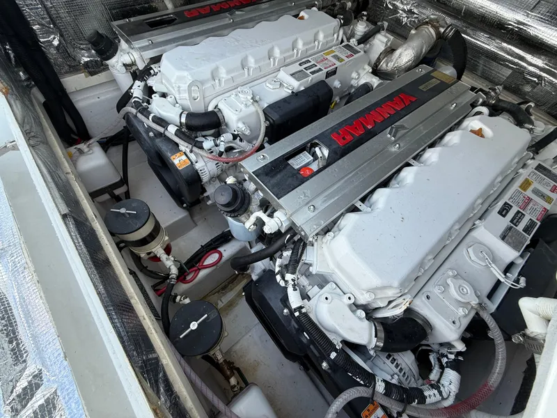 Slide: The Image of Twin Yanmar engines in a 2003 Strike 35 Cuddy boat engine compartment. - 8