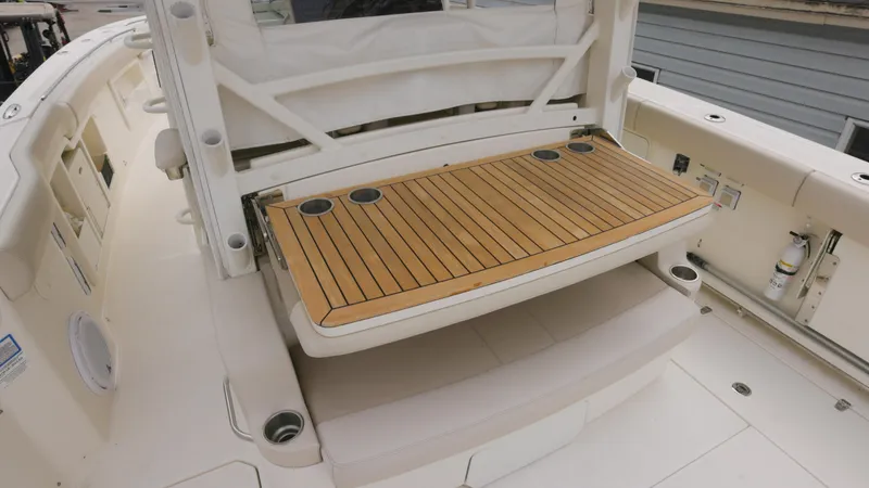 Slide: The Image of 2018 Boston Whaler 380 Outrage boat with teak deck detail. - 12