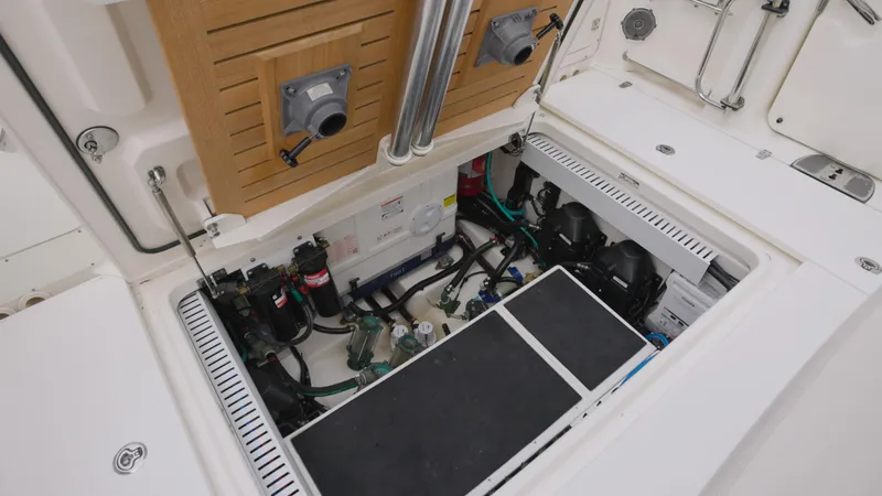Slide: The Image of 2018 Boston Whaler 380 Outrage engine compartment with visible components and wiring. - 22