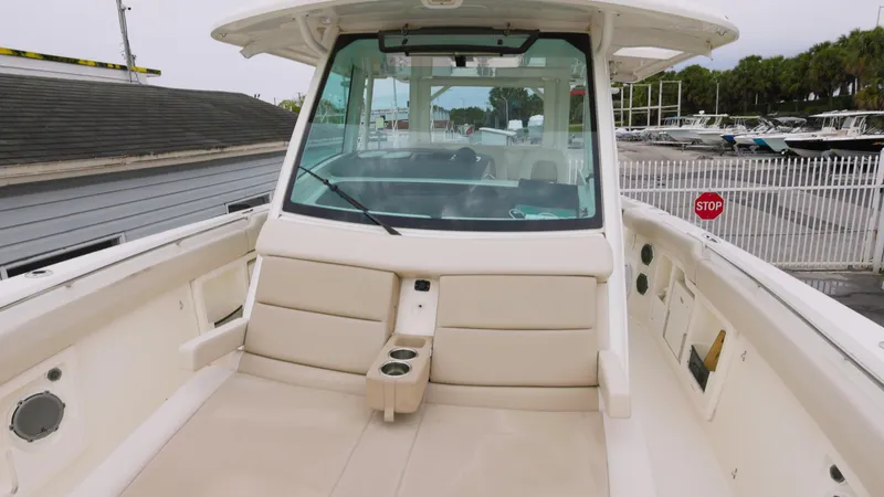 Slide: The Image of 2018 Boston Whaler 380 Outrage boat interior with seating and windshield. - 3