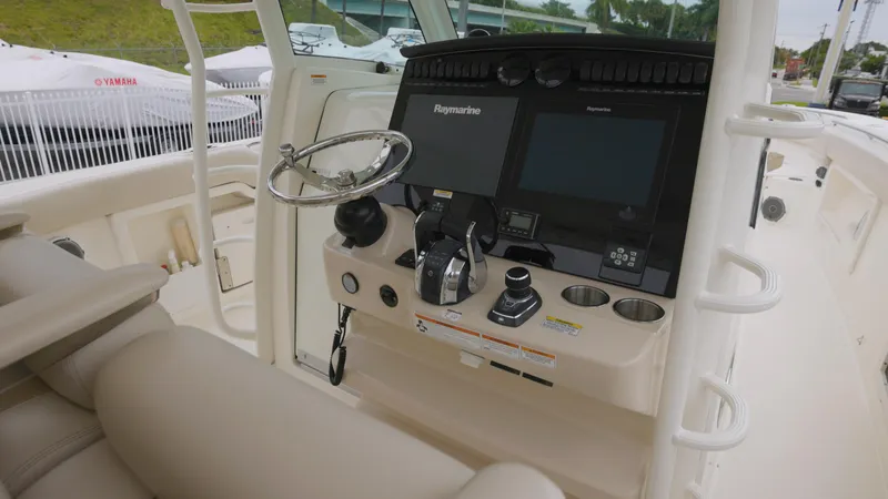 Slide: The Image of 2018 Boston Whaler 380 Outrage helm with advanced navigation systems and controls. - 6