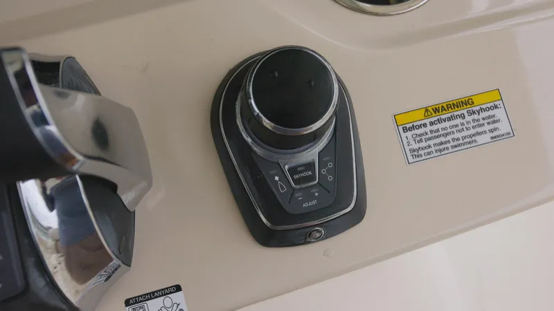 Slide: The Image of Control panel on a 2018 Boston Whaler 380 Outrage boat with warning labels. - 7