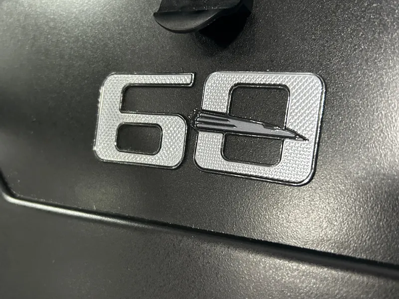 Slide: The Image of Close-up of '60' emblem on 2025 Chaparral 23 SSi boat. - 10