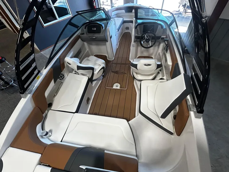 Slide: The Image of 2025 Chaparral 23 SSi boat interior with sleek seating and modern dashboard design. - 4