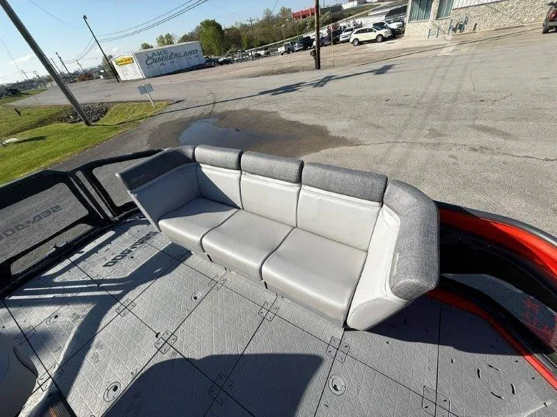 Slide: The Image of 2024 Sea-Doo SWITCH COMPACT 130HP with gray seating on a sunny day. - 11