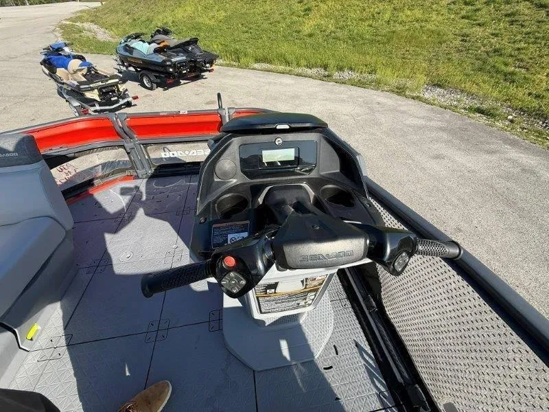 Slide: The Image of 2024 Sea-Doo SWITCH COMPACT 130HP dashboard and controls, parked on a sunny day. - 14