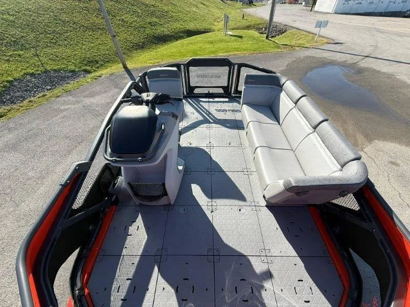 Slide: The Image of 2024 Sea-Doo SWITCH COMPACT 130HP boat interior with seating and steering console. - 22