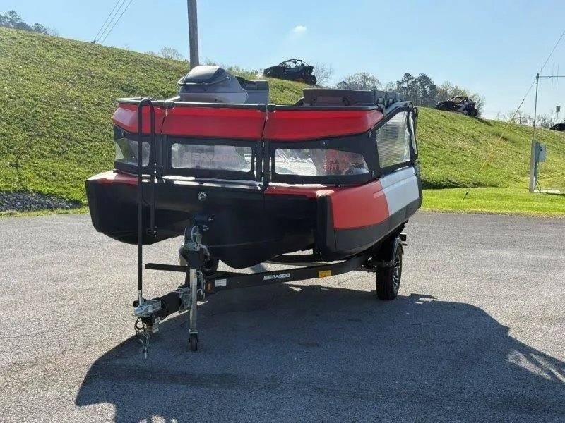 Slide: The Image of 2024 Sea-Doo SWITCH COMPACT 130HP on trailer, parked outdoors, sunny day. - 31