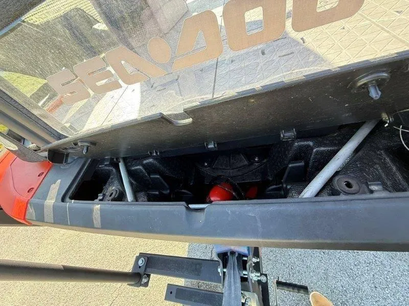 Slide: The Image of 2024 Sea-Doo SWITCH COMPACT 130HP storage compartment with visible interior components. - 39