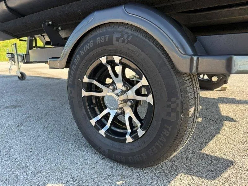 Slide: The Image of 2024 Sea-Doo SWITCH COMPACT 130HP trailer wheel with stylish black and silver rim design. - 40