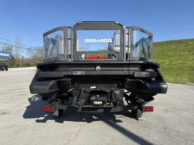 Slide: The Image of 2024 Sea-Doo SWITCH COMPACT 130HP pontoon boat, rear view on trailer, outdoors. - 5