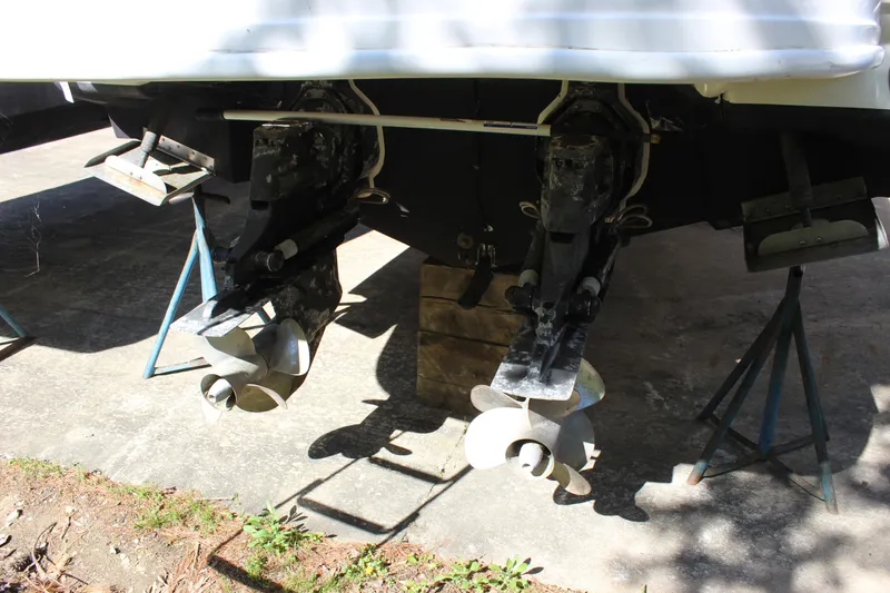 Slide: The Image of 2005 Sea Ray 290 Sundeck boat propellers on stands, rear view. - 8