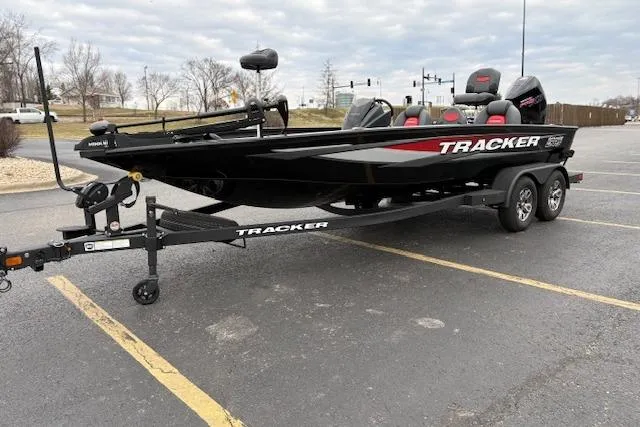 Slide: The Image of 2025 Tracker Savage 215 boat on trailer in parking lot. - 127