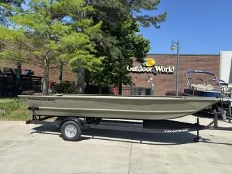 The Image of 2025 Tracker Grizzly 2072 Utility boat on trailer, parked outdoors with autumn trees. - 0