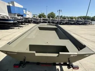 Slide: The Image of 2025 Tracker Grizzly 2072 Utility boat on trailer, outdoors, grassy area. - 3