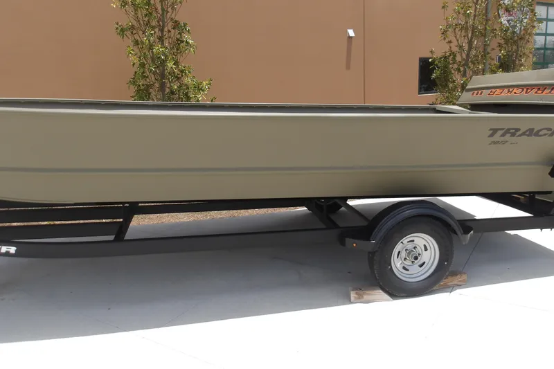 Slide: The Image of 2025 Tracker Grizzly 2072 Utility boat on trailer, parked outdoors. - 10