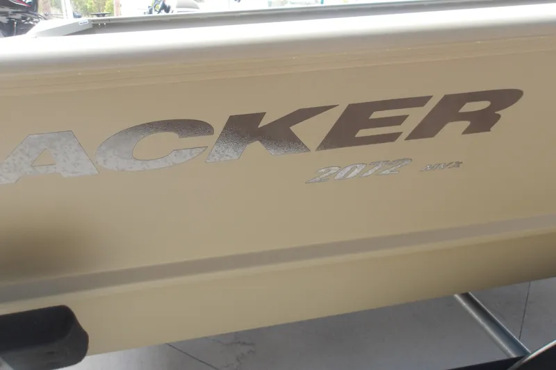 Slide: The Image of 2025 Tracker Grizzly 2072 Utility boat side view with model branding. - 6