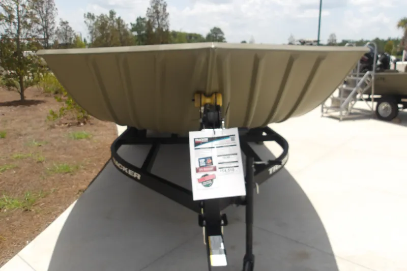The Image of 2025 Tracker Grizzly 2072 Utility boat on trailer, displayed outdoors. - 1