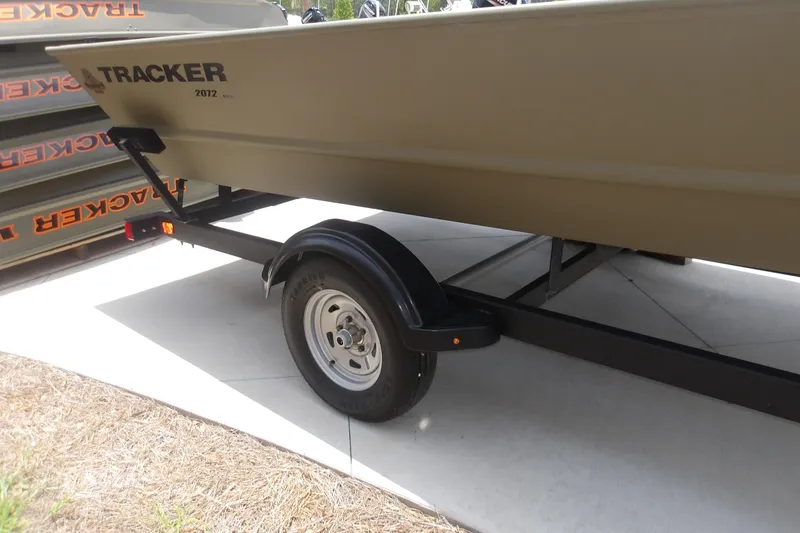 Slide: The Image of 2025 Tracker Grizzly 2072 Utility boat on trailer, side view. - 9