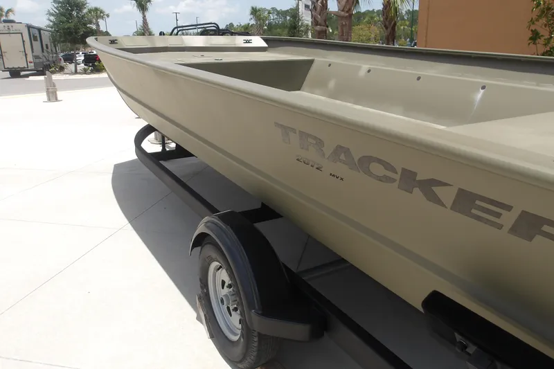 Slide: The Image of 2025 Tracker Grizzly 2072 Utility boat on trailer, outdoor display setting. - 4
