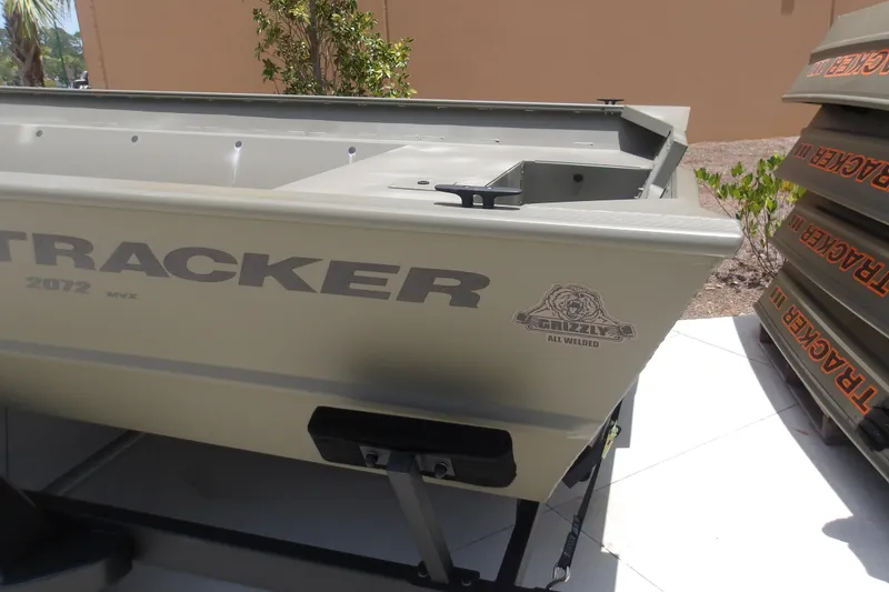 Slide: The Image of 2025 Tracker Grizzly 2072 Utility boat displayed outdoors, showcasing its robust design. - 3