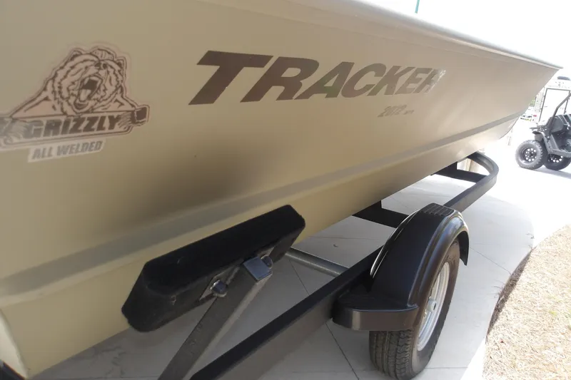 Slide: The Image of 2025 Tracker Grizzly 2072 Utility boat on trailer, showcasing "All Welded" design. - 7