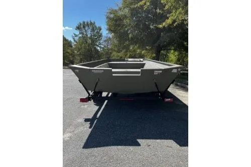 Slide: The Image of 2025 Tracker Grizzly 2072 Utility boat on trailer, parked outdoors. - 3