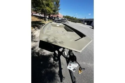 Slide: The Image of 2025 Tracker Grizzly 2072 Utility boat on trailer in outdoor setting. - 4