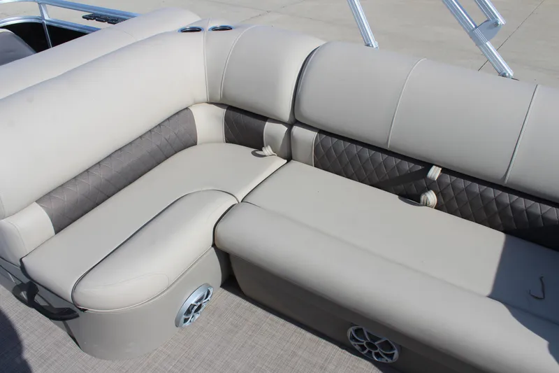 Slide: The Image of 2025 Sun Tracker SportFish 20 DLX boat interior with beige cushioned seating. - 14