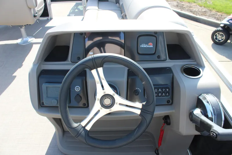 Slide: The Image of Steering console of 2025 Sun Tracker SportFish 20 DLX pontoon boat, featuring modern controls. - 16