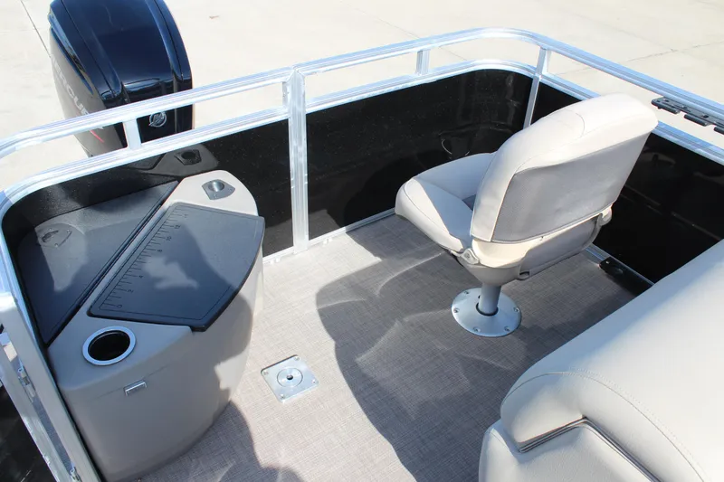 Slide: The Image of 2025 Sun Tracker SportFish 20 DLX boat interior with seating and fishing station. - 18
