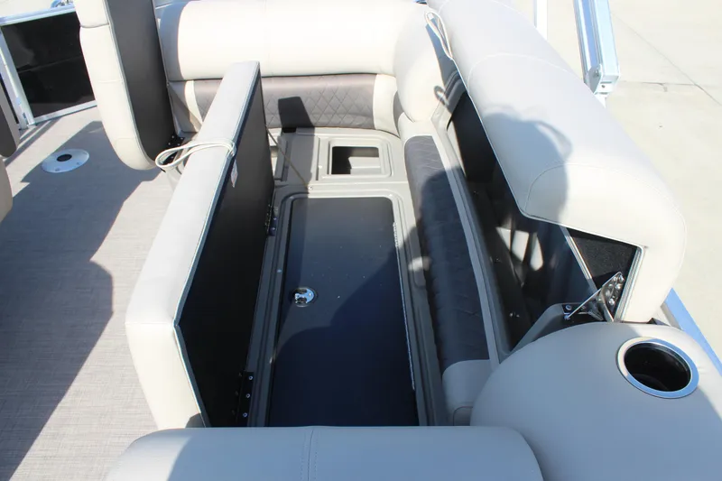 Slide: The Image of 2025 Sun Tracker SportFish 20 DLX pontoon boat interior with open storage compartments. - 25