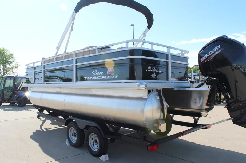 Slide: The Image of 2025 Sun Tracker SportFish 20 DLX pontoon boat with Mercury engine on trailer. - 5