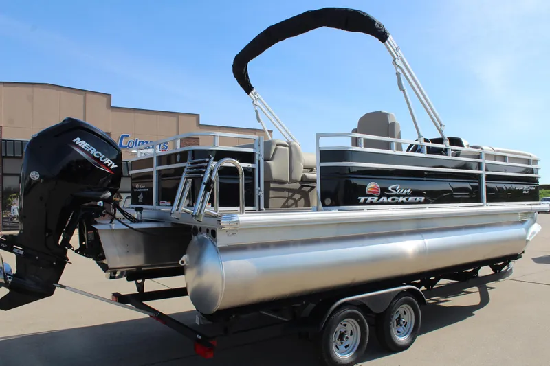 Slide: The Image of 2025 Sun Tracker SportFish 20 DLX pontoon boat with Mercury outboard engine on trailer. - 7