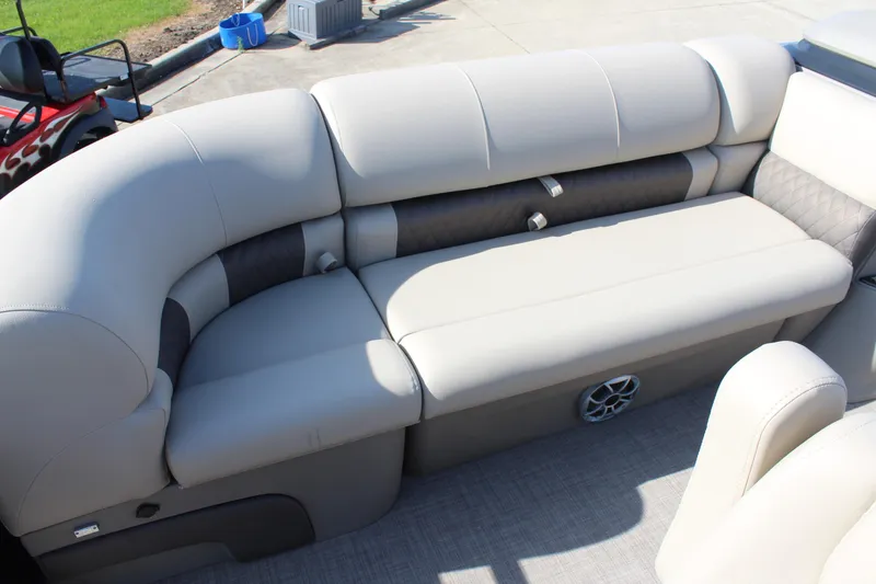 Slide: The Image of 2025 Sun Tracker SportFish 20 DLX pontoon boat with beige seating. - 9