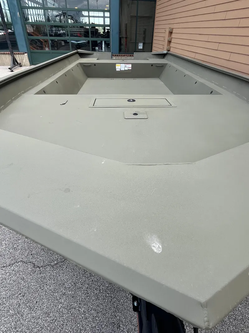 Slide: The Image of 2025 Tracker GRIZZLY 2072 Utility boat, spacious interior, docked outdoors. - 8