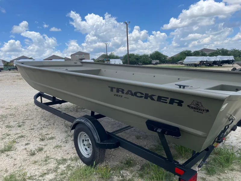 Slide: The Image of 2025 Tracker GRIZZLY 2072 Utility boat on trailer under a blue sky. - 3